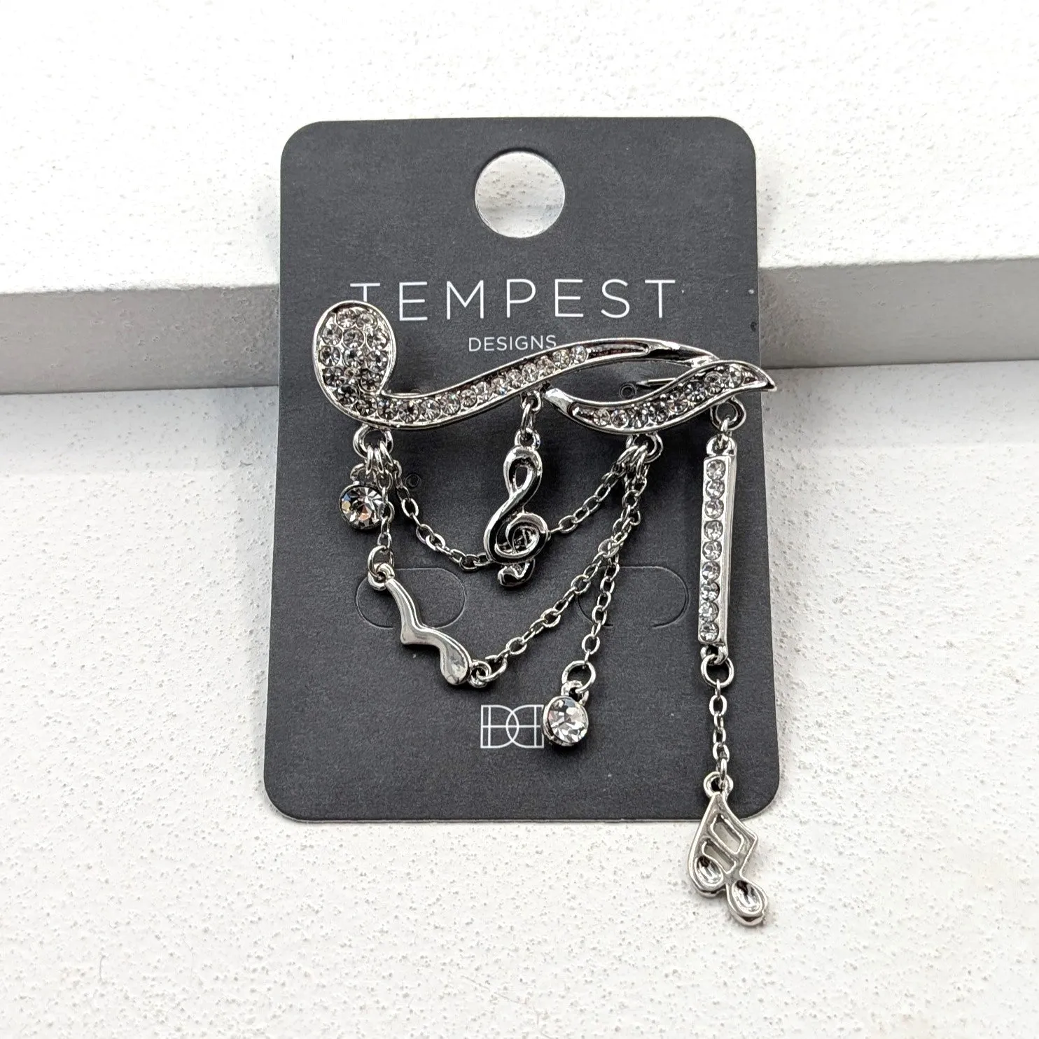 Crystal musical note brooch with chains and notes