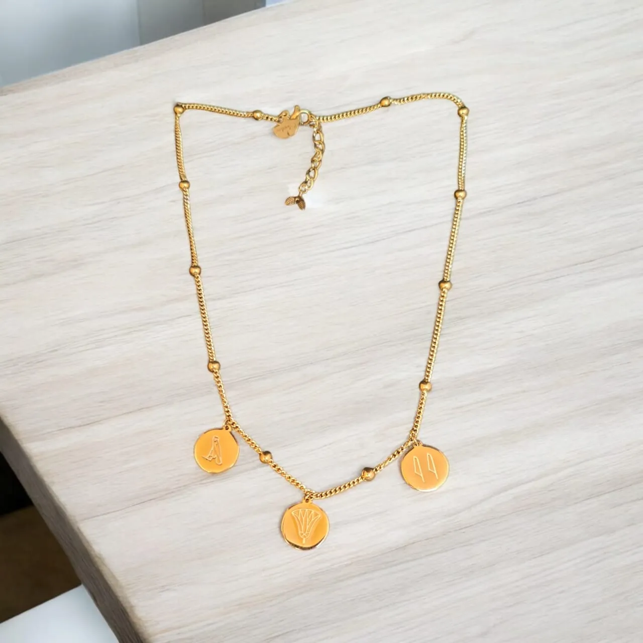 Gold-Plated Egyptian Symbols Necklace with Lotus, Horus, and Maat Pendants