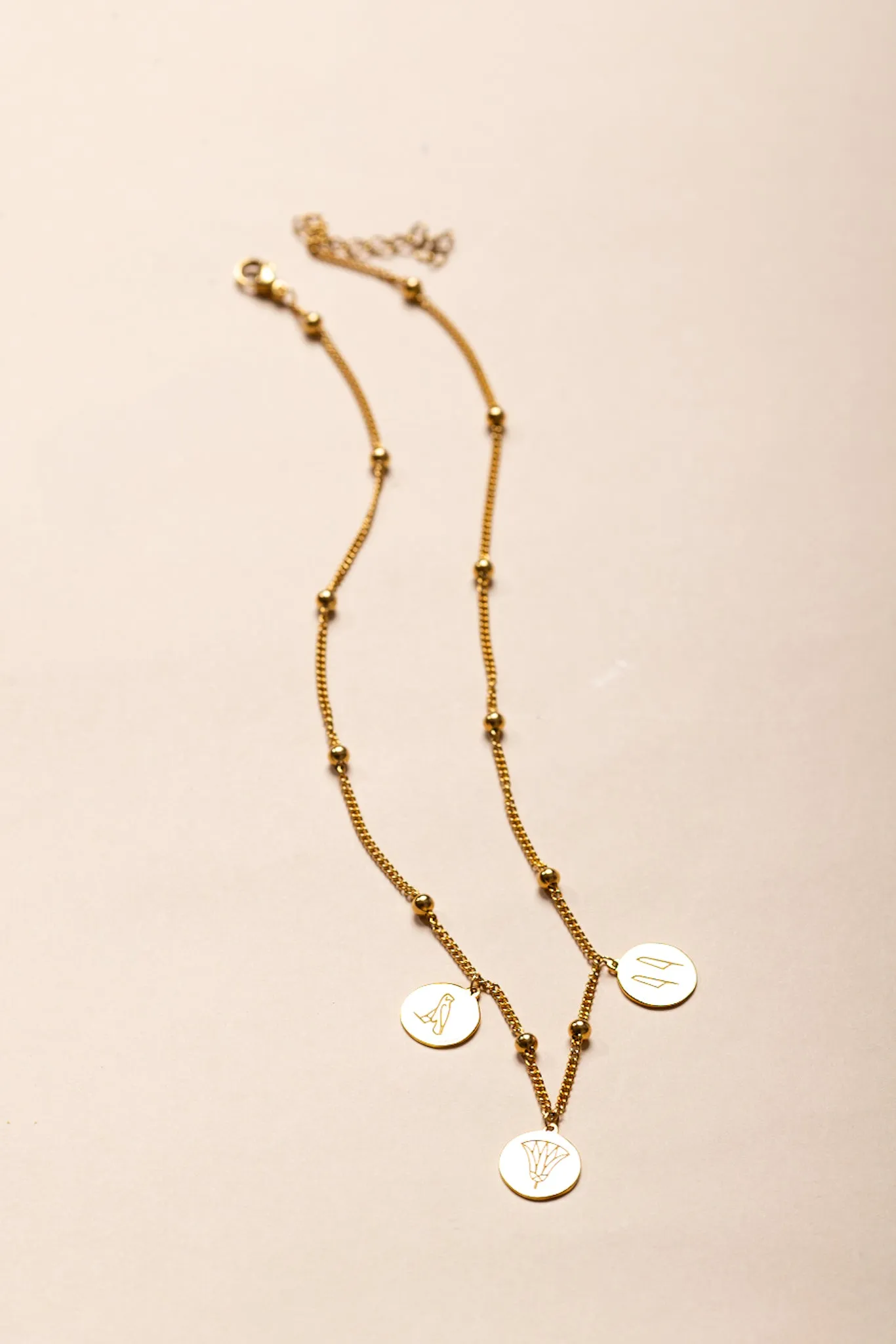Gold-Plated Egyptian Symbols Necklace with Lotus, Horus, and Maat Pendants
