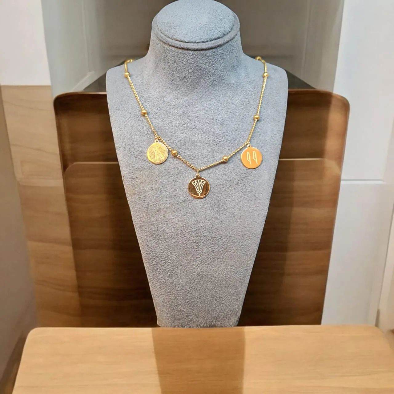 Gold-Plated Egyptian Symbols Necklace with Lotus, Horus, and Maat Pendants